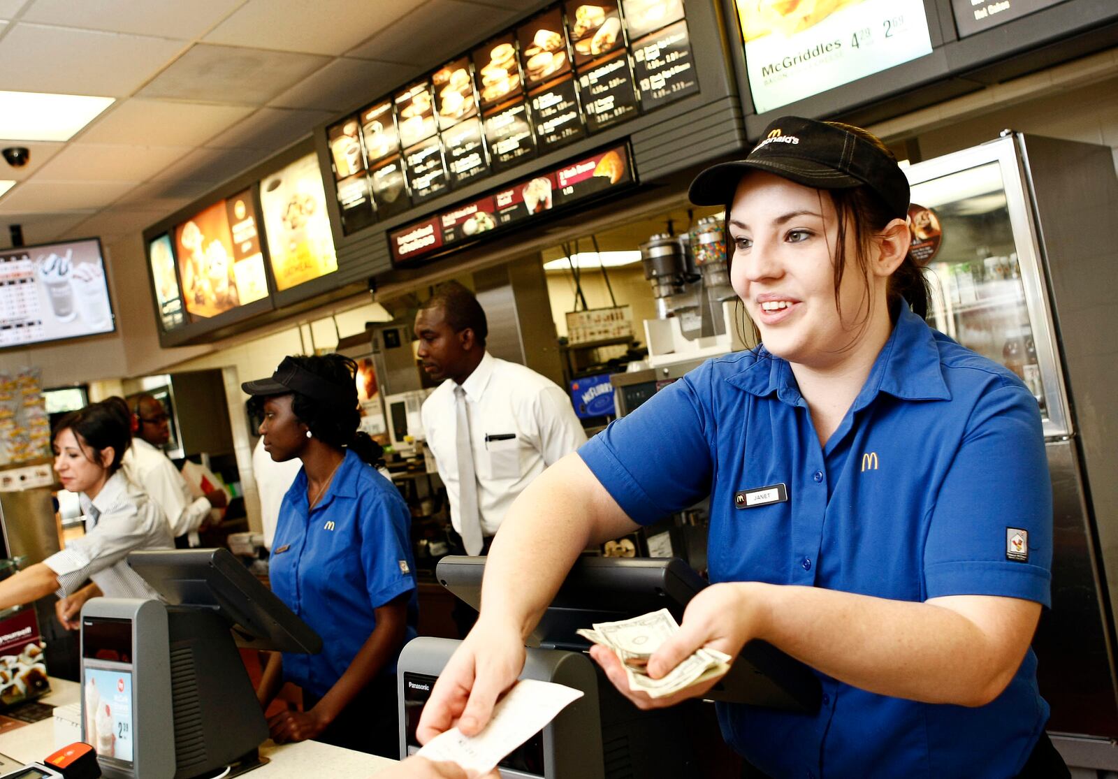 Janet Grant, an employee for three months, takes orders at the McDonald's on Alternate A1A in Palm Beach Gardens Friday morning.