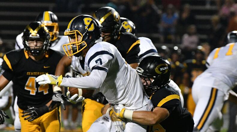 Centerville’s Jacob Yost (right) tackles Springfield senior running back Danny Davis (left) during a GWOC National East game on Friday at Centerville Stadium. The Elks led 14-6 at halftime. Contributed Photo by Bryant Billing