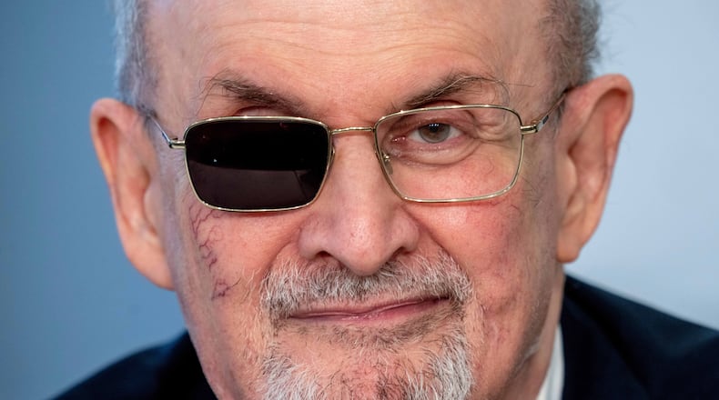 FILE - Author Salman Rushdie appears at a press conference at the Book Fair in Frankfurt, Germany on Oct. 20, 2023. (AP Photo/Michael Probst, File)