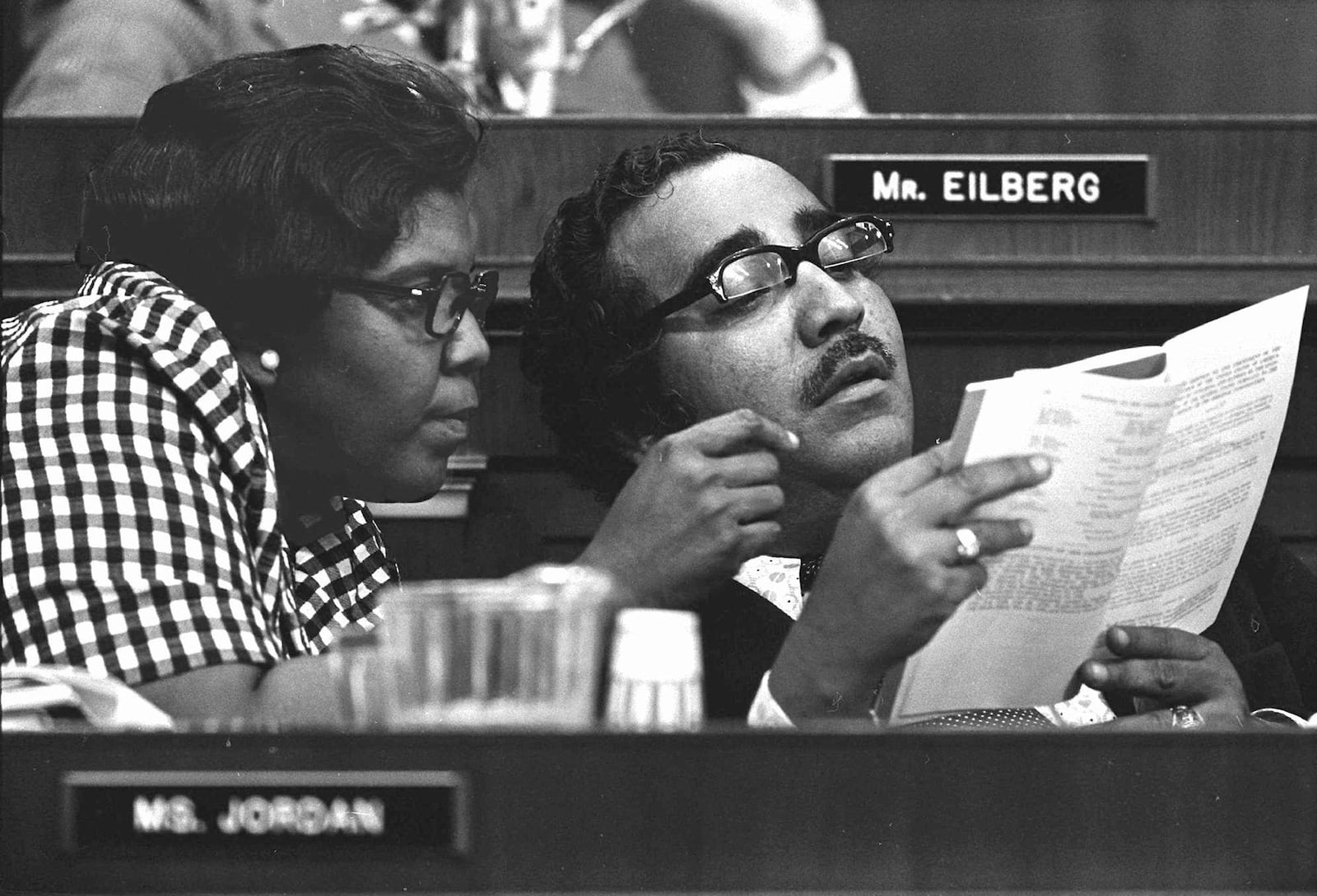 FILE - In this July 26, 1974 file photo, Reps. Charles Rangel, D-N.Y., and Barbara Jordan, D-Tex., left, look over a copy of the Constitution during a House Judiciary Committee debate on articles of impeachment for President Richard Nixon in Washington, D.C. (AP Photo/File)