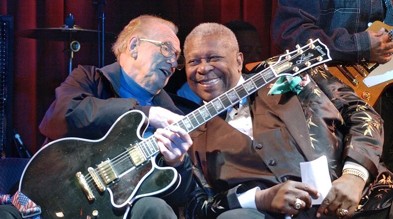 Music legends Les Paul, then 88, left, and B.B. King, then 77, at a jam session at the third anniversary celebration of the B.B. King Blues Club and Grill in New York’s Times Square, in 2003. AP Photo/Richard Drew