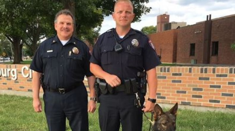 (From left): Miamisburg Police Chief John Sedlak, Officer Bryan Klein and K-9 Officer Buck. (Courtesy/Miamisburg Police Facebook)