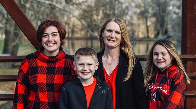 Master Sgt. Holly Maser, a first sergeant for the 455th Security Force Squadron at Wright-Patterson Air Force Base, poses with her 3 children. CONTRIBUTED PHOTO