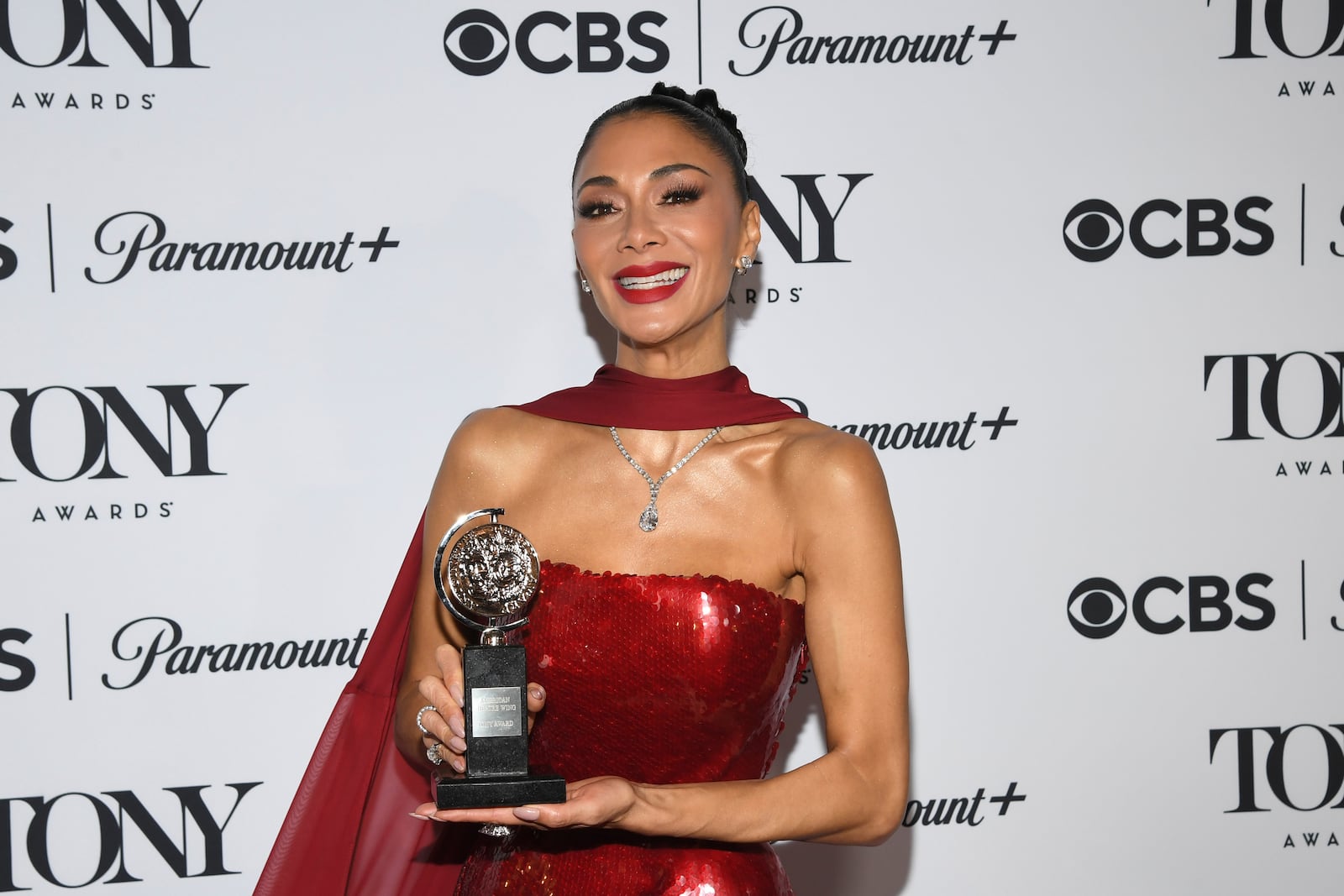 Nicole Scherzinger poses in the press room with the award for best performance by an actress in a leading role in a musical for "Sunset Blvd." during the 78th Tony Awards on Sunday, June 8, 2025, at Radio City Music Hall in New York. (Photo by Evan Agostini/Invision/AP)