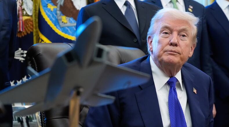 President Donald Trump listens to a question from a reporter as he speaks in the Oval Office of the White House, Monday, Feb. 2, 2026, in Washington. (AP Photo/Alex Brandon)