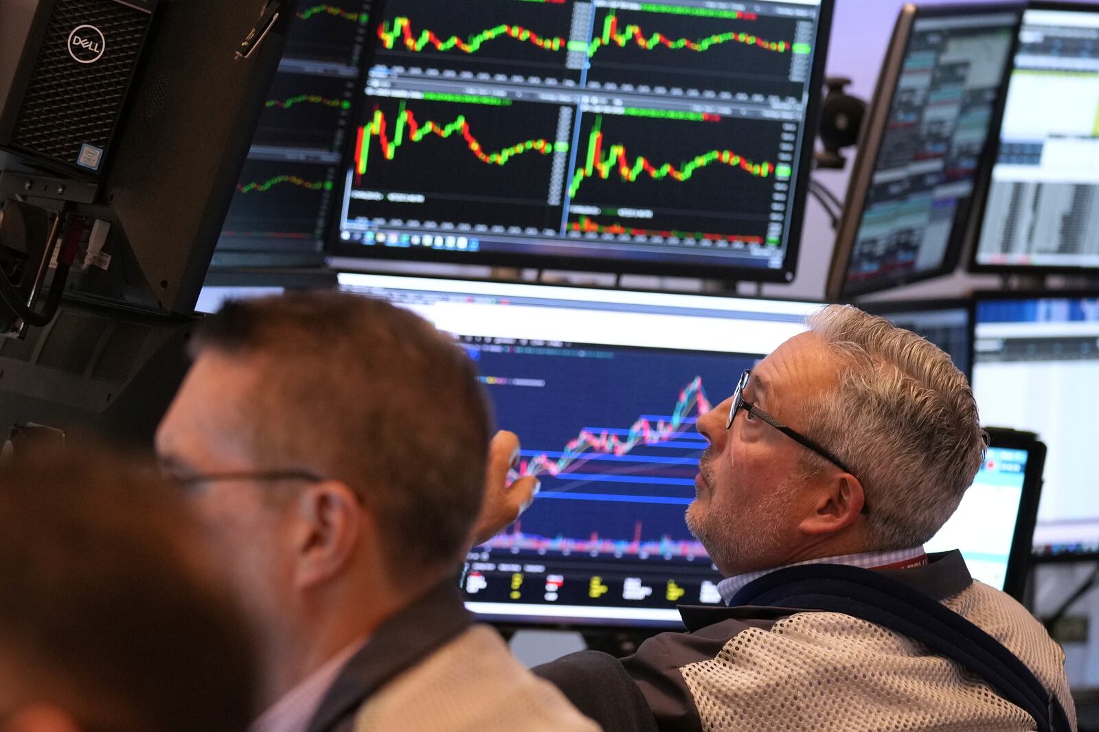 Traders work on the floor at the New York Stock Exchange in New York, Monday, April 7, 2025. (AP Photo/Seth Wenig)