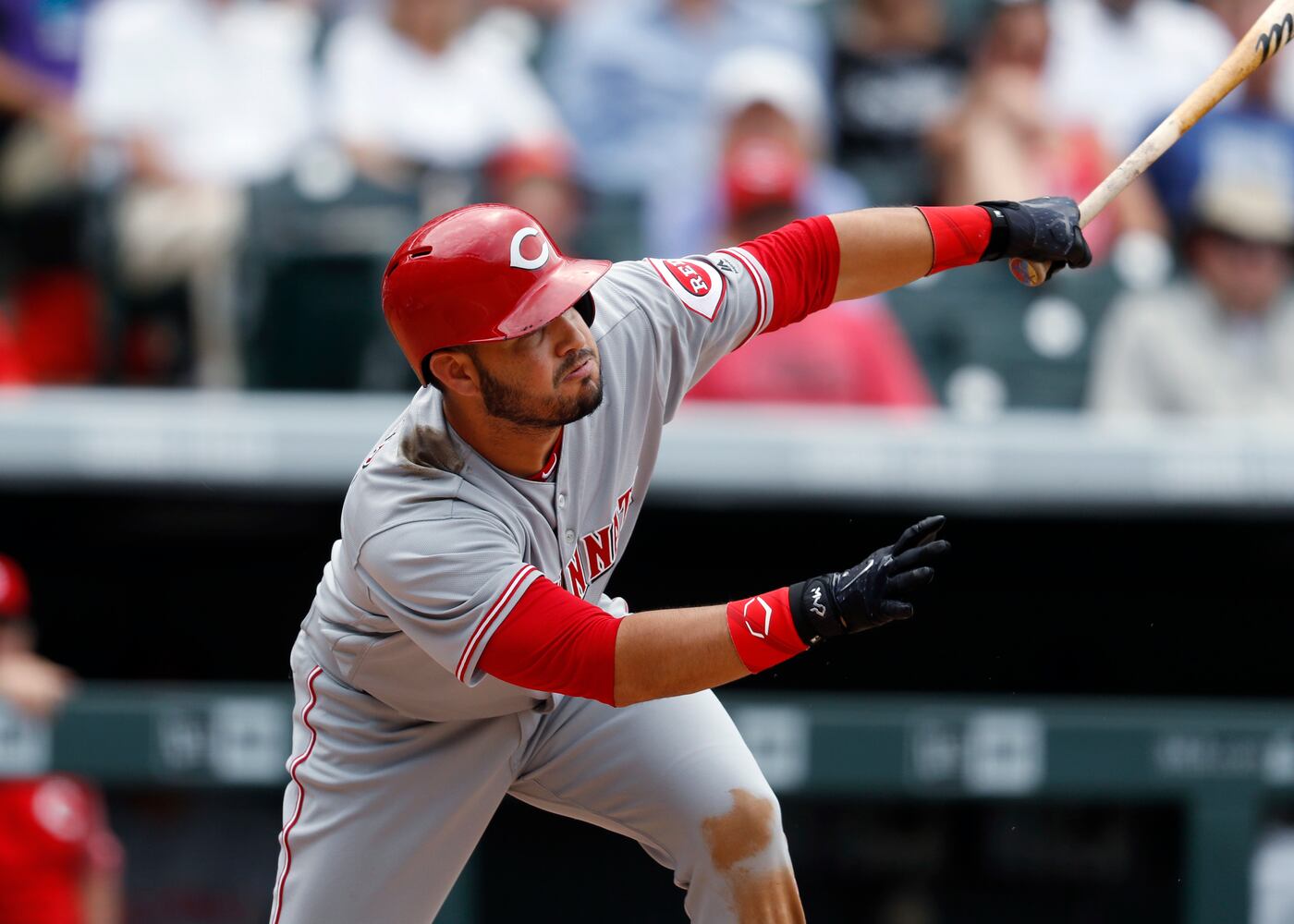 PHOTOS: Reds pile up 13 hits, beat the Rockies