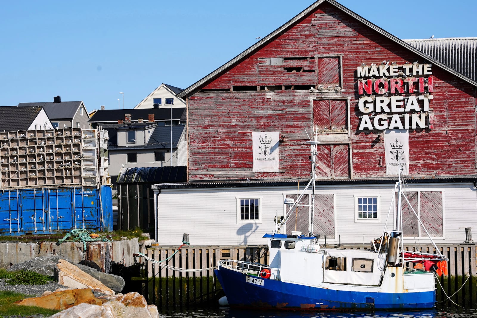 Seagulls sit in boxes of a so called Seagull Hotel at the harbour in Vardo, Norway, on July 3, 2025. (AP Photo/Tommi Ojala )