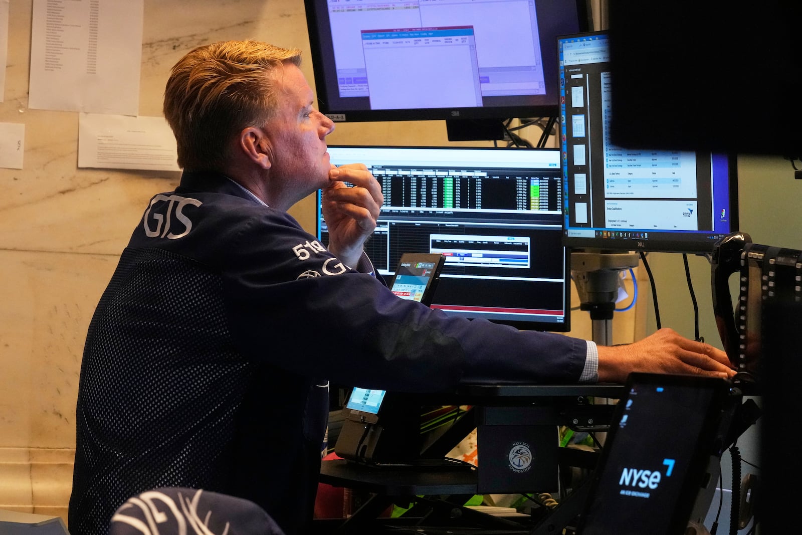 Trader John Bowers works on the floor of the New York Stock Exchange, Tuesday, July 8, 2025. (AP Photo/Richard Drew)