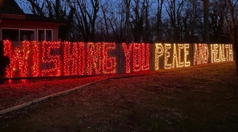 Thomas Loges and his wife, Amy, have put this heartwarming message outside of their Harrison Township home.
