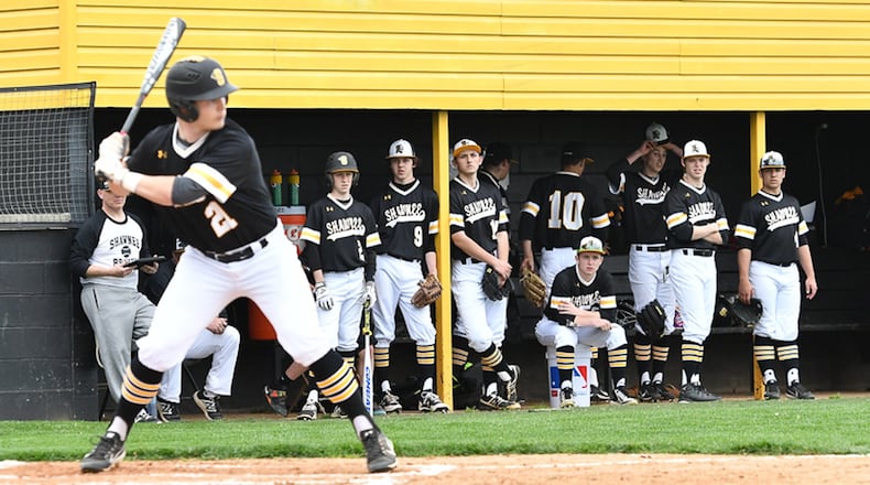 Springfield Shawnee teammates watch a pitch with Tanner Vanvelzor at the plate during a Central Buckeye Conference game at Gary E. Flora Field. Contributed Photo by Bryant Billing