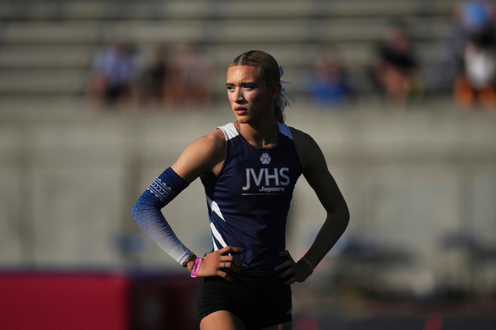 AB Hernandez, a transgender student at Jurupa Valley High School, stands on the field during the California high school track-and-field championships in Clovis, Calif., Saturday, May 31, 2025. (AP Photo/Jae C. Hong)