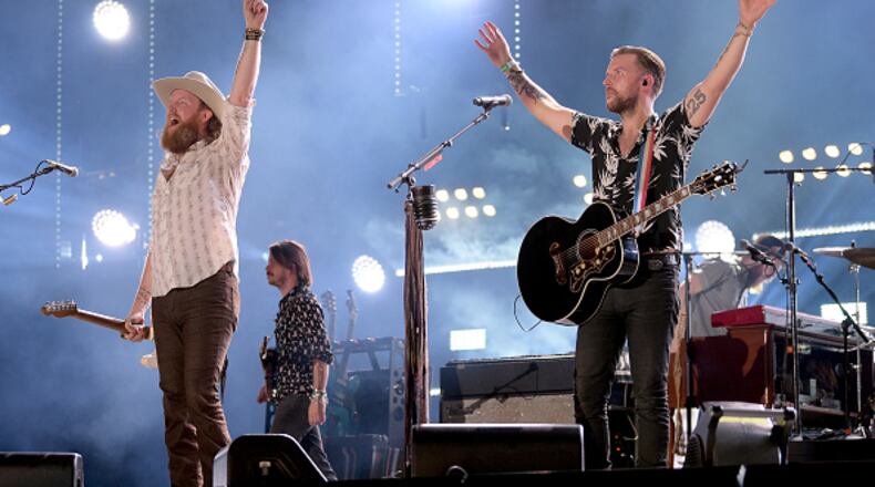 NASHVILLE, TN - JUNE 07:  (EDITORIAL USE ONLY) John Osborne (L) and T.J. Osborne (R) of musical duo Brothers Osborne perform onstage during the 2018 CMA Music festival at the Nissan Stadium on June 7, 2018 in Nashville, Tennessee.  (Photo by Jason Kempin/Getty Images)
