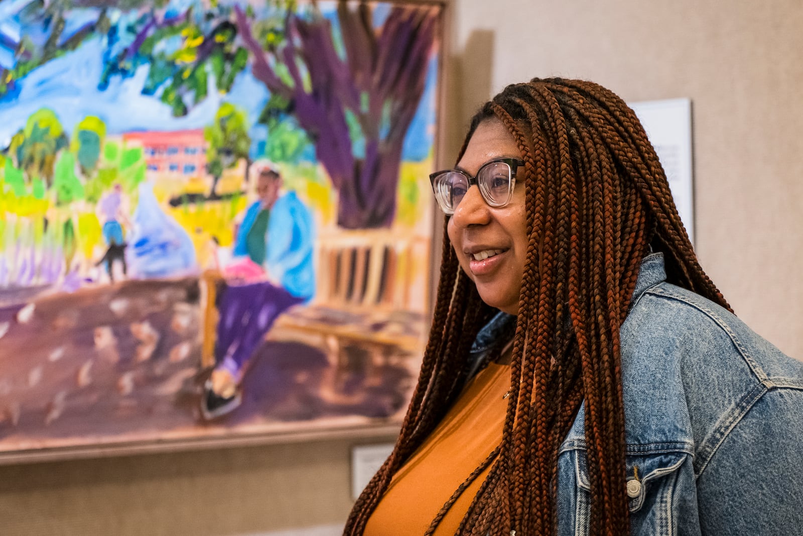 Devon Yarbrough, Digital Communications Manager at the George W. Bush Presidential Center, speaks about being part of one of the paintings by President George W. Bush on display in an exhibit at the George W. Bush Presidential Museum, Thursday, May 15, 2025, in Dallas. (AP Photo/Jessica Tobias)