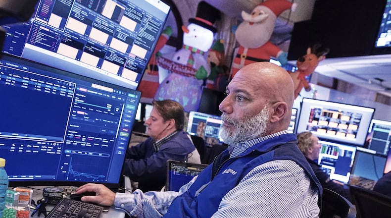 Trader Vincent Napolitano works on the floor of the New York Stock Exchange, Tuesday, Dec. 2, 2025. (AP Photo/Richard Drew)