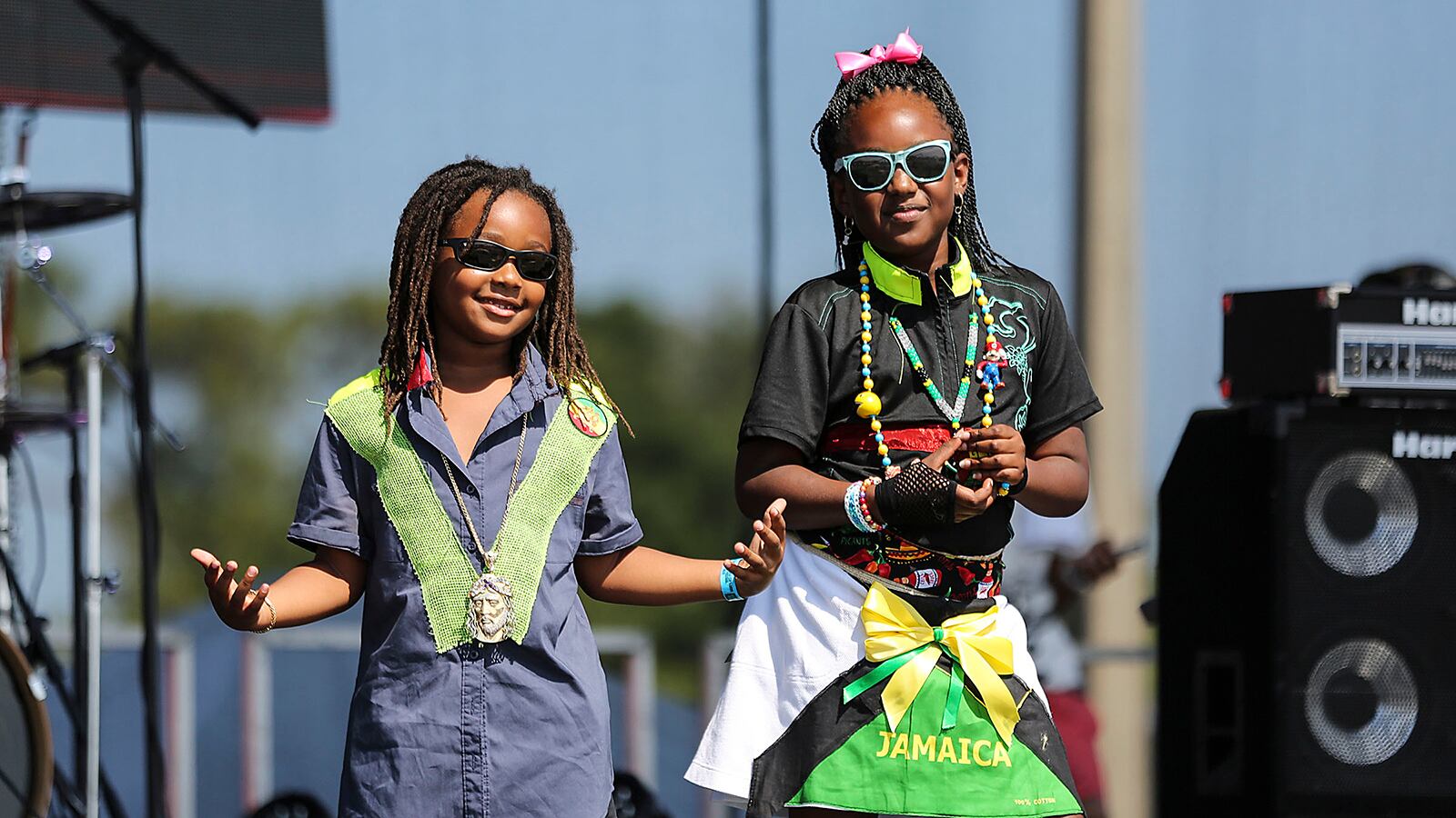 Jaylan Armstrong, 8, and Ceacia Wright, 9, models fashions designed by Angela D. Williamson of Raggamuffin Couture, Co. during the 11th annual Palm Beach Jerk and Caribbean Culture Festival at the South Florida Fairgrounds, Monday, May 26, 2014.  (Damon Higgins / The Palm Beach Post)