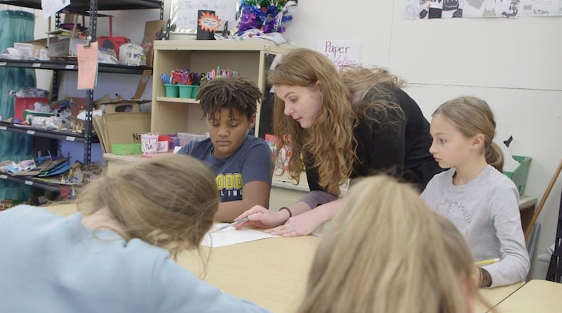 Art teacher Whitney Rivard works with students at Harman School on still-life drawing.  Respondents to an Oakwood schools survey indicated teachers were among the top sources of where they get information about the district. CONTRIBUTED