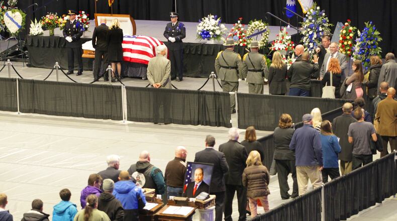 The public viewing for Dayton police Det. Jorge Del Rio was held Monday night at the University of Dayton Arena. Del Rio was shot Nov. 4 while serving a search warrant on a suspected drug house. Del Rio will be honored with a procession today that will carry him through Dayton and the surrounding communities to a private service at Tobias Funeral Home. LISA POWELL / STAFF