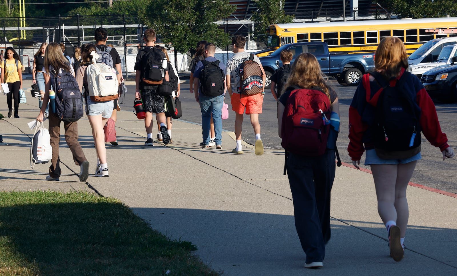 Students arrive Wednesday, Aug. 14, 2024 for the first day of school at Beavercreek High School. MARSHALL GORBY\STAFF