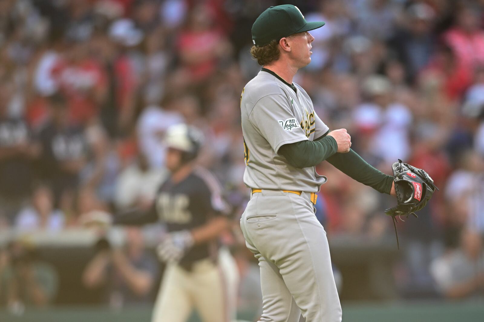 Athletics starting pitcher JP Sears waits for Cleveland Guardians' David Fry to run the bases after hitting a two-run home run during the third inning of a baseball game, Friday, July 18, 2025, in Cleveland. (AP Photo/David Dermer)