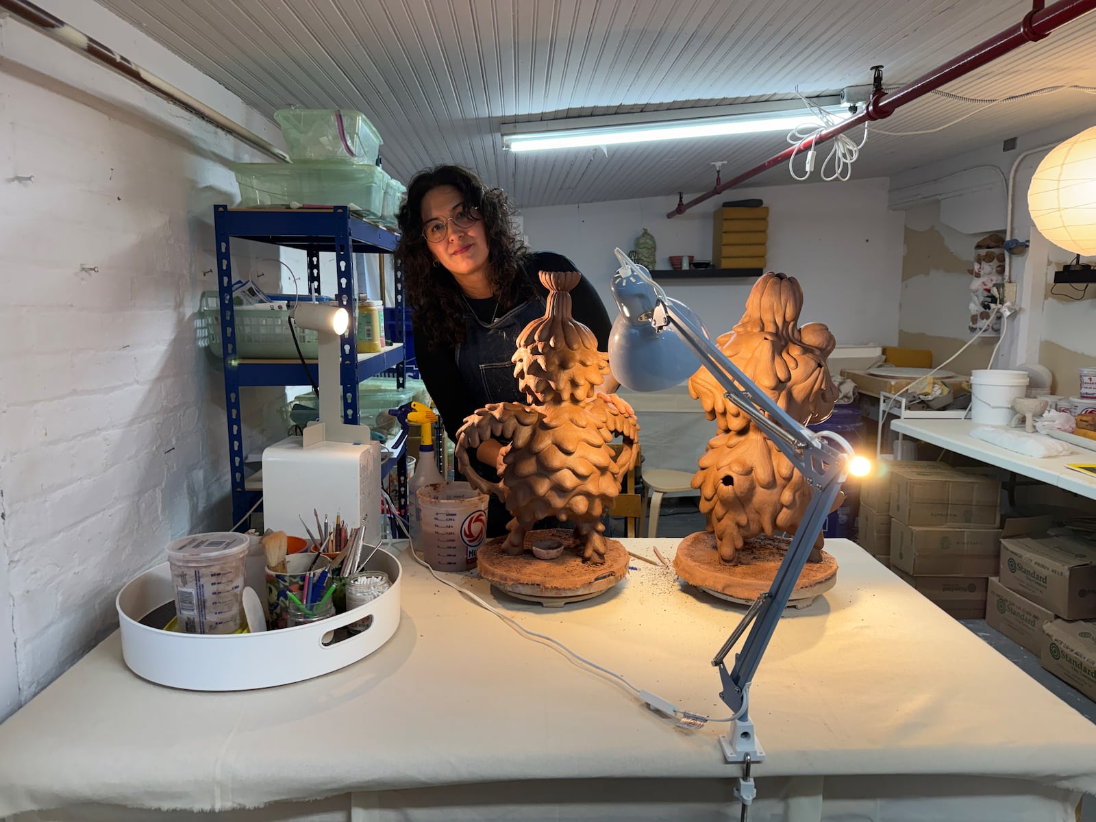 Nereida Trujillo sculpting clay. She shares one side of the Front Street studio with fellow ceramicist, Leslie Sells, who she is related to through marriage. HANNAH KASPER/CONTRIBUTED