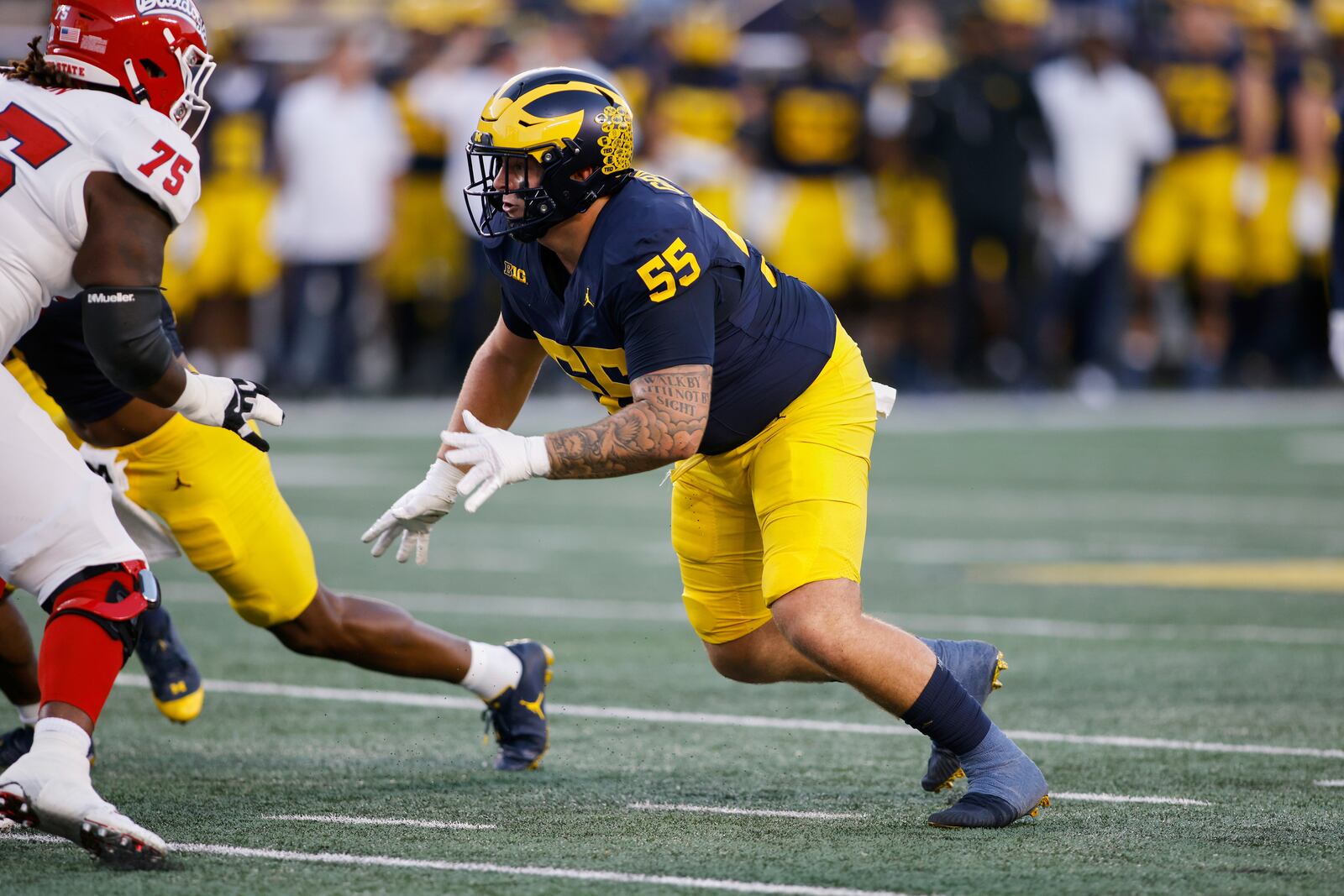 FILE - Michigan defensive lineman Mason Graham (55) rushes during an NCAA football game on Saturday, Aug. 31, 2024, in Ann Arbor, Mich. (AP Photo/Al Goldis, File)