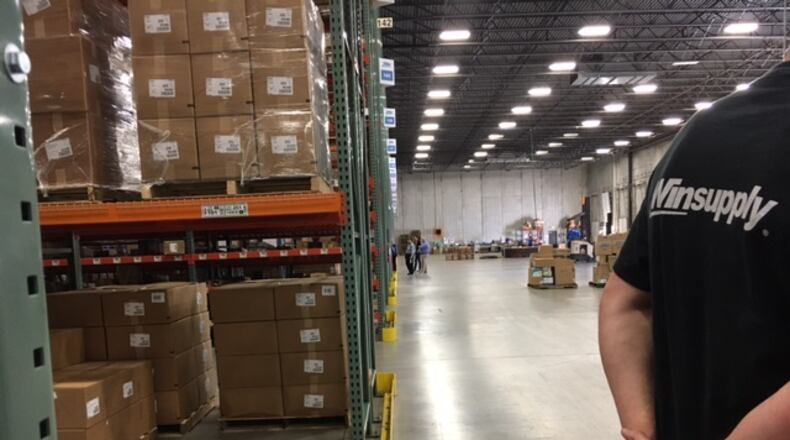 Members of the Dayton Area Logistics Association toured the Winsupply regional distribution center in Miamisburg last year. THOMAS GNAU/STAFF