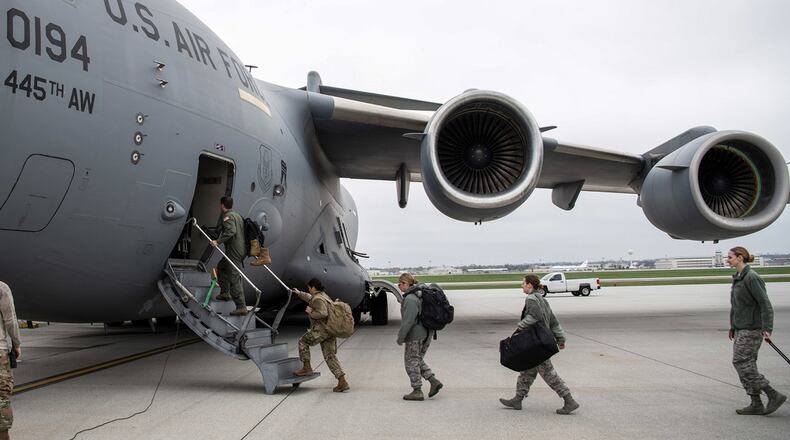 A doctor and several nurses from the 445th Airlift Wing’s Aerospace Medicine and Aeromedical Staging Squadrons, board a C-17 Globemaster III here April 5, 2020 heading to Joint Base McGuire-Dix-Lakehurst. (U.S. Air Force photo/Mr. Patrick O’Reilly)