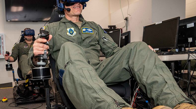 Col. Matthew Crowell, Air Force Safety Center chief of aviation safety, and Capt. Phillip Butler, 314th Fighter Squadron, operate their virtual aircraft at Air Force Research Laboratory’s Directed Energy and Directed Energy Utility Concept Experiment (DEKE DEUCE) held at Kirtland Air Force Base, N.M., Jan. 24-28. The experiment explored synergies between directed energy and kinetic concepts in the future battlespace. U.S. AIR FORCE PHOTO/ALLEN WINSTON