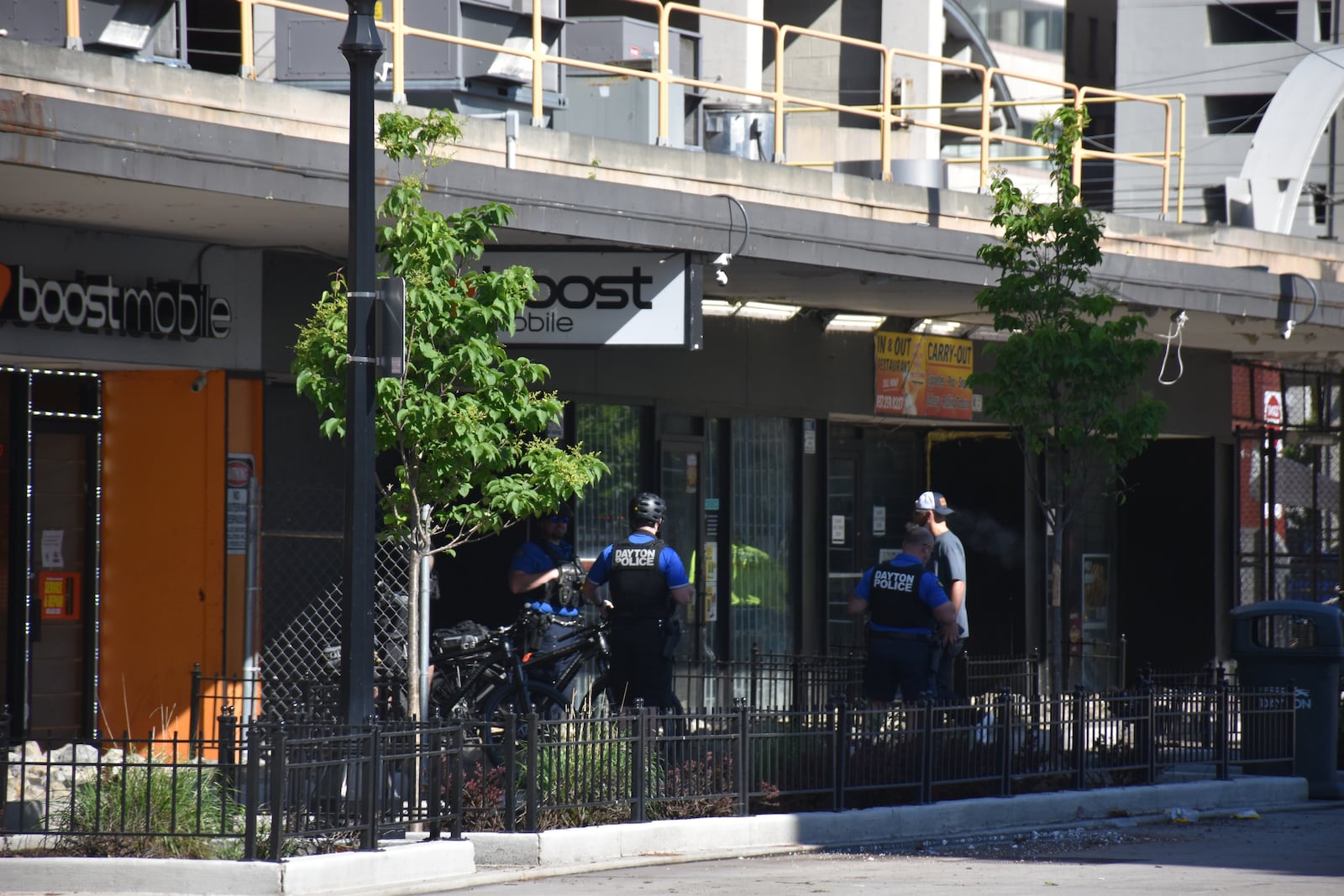 Dayton police officers on South Jefferson Street, in front of a couple of storefronts in the Air City Garage. Police have responded to a significant number of calls near the downtown bus hub on South Jefferson. CORNELIUS FROLIK / STAFF