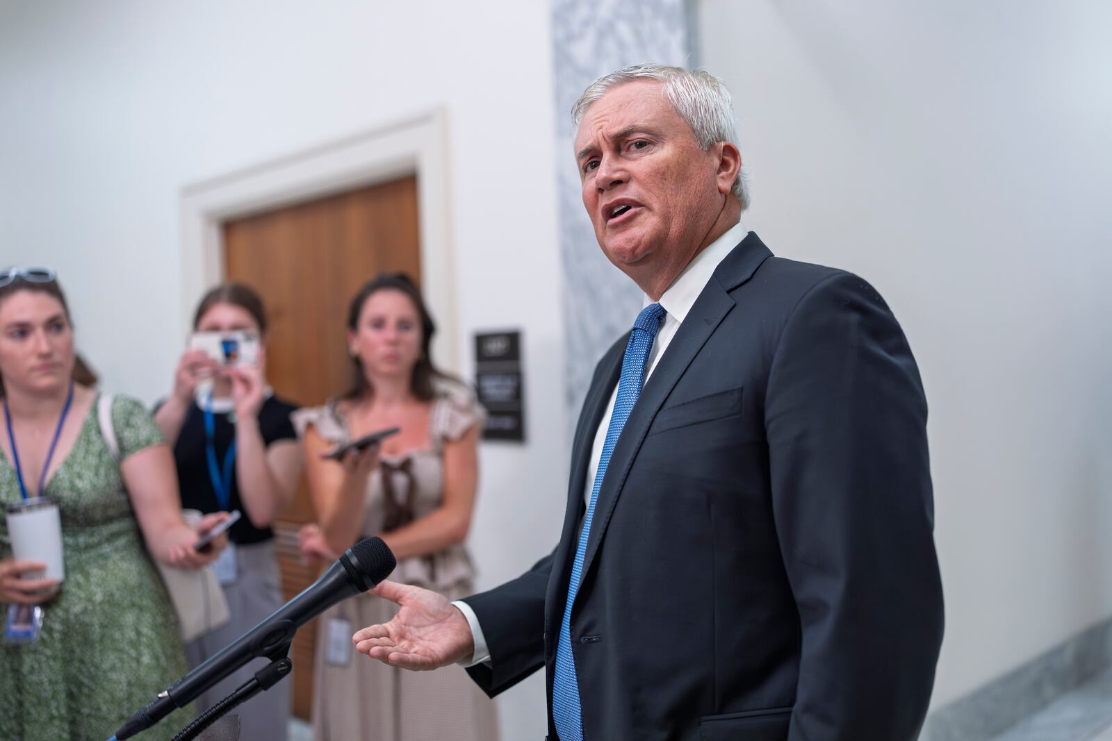 Rep. Jamie Comer, R-Ky., chairman of the House Oversight and Accountability Committee, talks to reporters briefly before hearing testimony from former President Joe Biden's physician, Dr. Kevin O'Connor, part of a broad inquiry by House Republicans looking into Biden's mental state during his time in office, at the Capitol in Washington, Wednesday, July 9, 2025. (AP Photo/J. Scott Applewhite)
