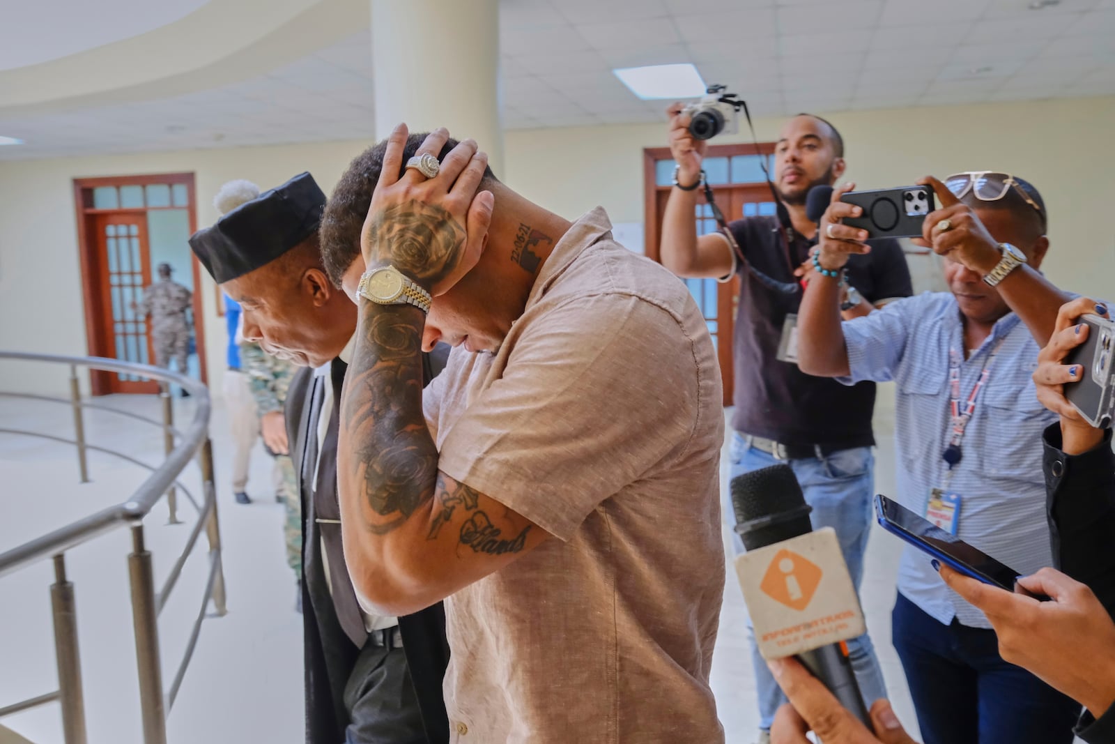Tampa Bay Rays shortstop Wander Franco touches his head as he walks with his attorney Teodosio Jaquez, left, during a break in his trial on charges of sexual abuse of a minor in Puerto Plata, Dominican Republic, Monday, June 23, 2025. (AP Photo/Ricardo Hernandez)
