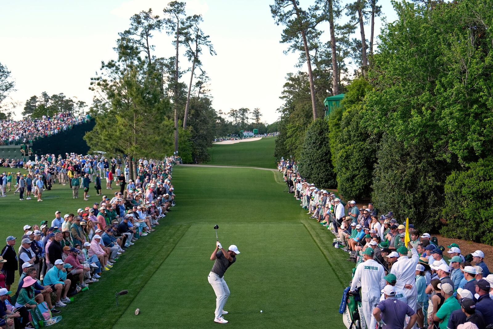 Scottie Scheffler hits his tee shot on the 18th hole during the third round at the Masters golf tournament, Saturday, April 12, 2025, in Augusta, Ga. (AP Photo/Julia Demaree Nikhinson)