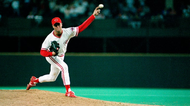 FILE - Cincinnati Reds pitcher Tom Browning delivers a pitch during a game against the Los Angeles Dodgers at Riverfront Stadium in Cincinnati, Sept. 16, 1988. Browning threw a perfect game as the Reds won 1-0. Browning, an All-Star pitcher who threw the only perfect game in Cincinnati Reds history and helped them win a World Series title, died on Monday, Dec. 19, 2022. He was 62. (AP Photo, File)