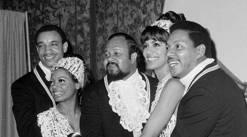 FILE - Members of the Fifth Dimension, from left, LaMonte McLemore, Florence LaRue, Ron Townson, Marilyn McCoo, and Billy Davis, Jr., pose with their Grammy Award in Los Angeles on Feb. 29, 1968. (AP Photo/Harold P. Matosian, File)