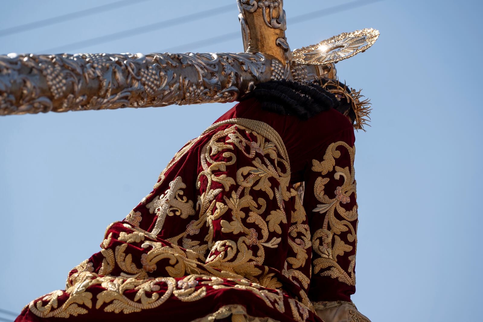 A statue of Jesus of Nazareth wears a tunic created by weavers at the Maria Auxiliadora embroidery workshop, during a Lenten season procession in Antigua, Guatemala, Sunday, April 6, 2025. (AP Photo/Santiago Billy)