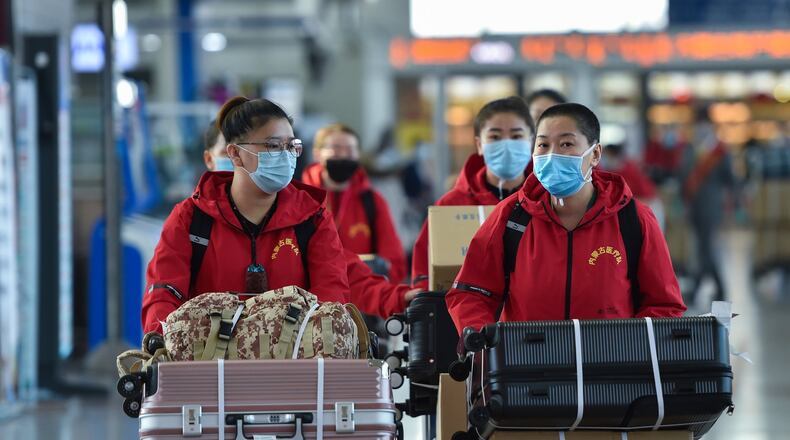 Medical team members prepare to check in at Hohhot Baita International Airport before leaving for Hubei Province in Hohhot, capital of north China’s Inner Mongolia Autonomous Region, on Tuesday, Feb. 18, 2020. The seventh batch of medical workers from Inner Mongolia Autonomous Region to Hubei Province departed Tuesday to help the novel coronavirus control efforts there. (Liu Lei/Xinhua/Zuma Press/TNS)