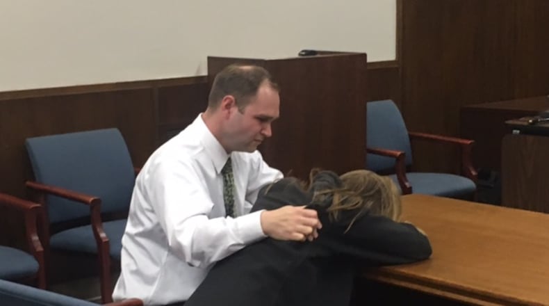 Former Miamisburg Middle School teacher Jessica Langford was consoled by her husband when she broke down in tears in April 2018 after a jury found her guilty of having sex with a 14-year-old in her classroom. NICK BLIZZARD/STAFF
