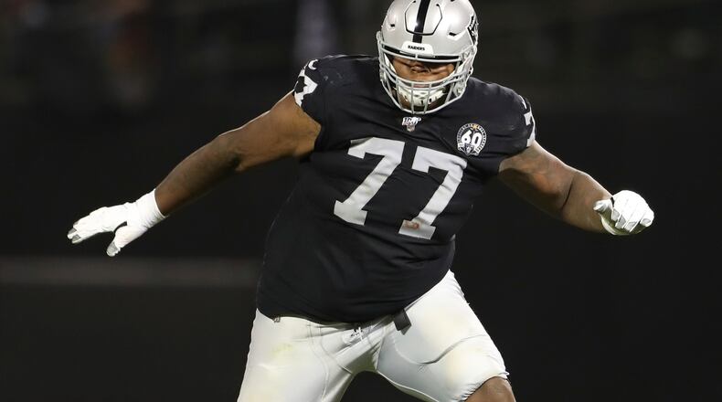 FILE - In this Sept. 9, 2019, file photo, Oakland Raiders offensive tackle Trent Brown (77) protects a gap in the offensive line during an NFL football game against the Denver Broncos, in Oakland, Calif. Las Vegas Raiders general manager Mike Mayock says the “jury is still out” on whether highly paid right tackle Trent Brown will be back in 2021 after being limited by injuries in his first two seasons with the team. (AP Photo/Peter Joneleit, File)