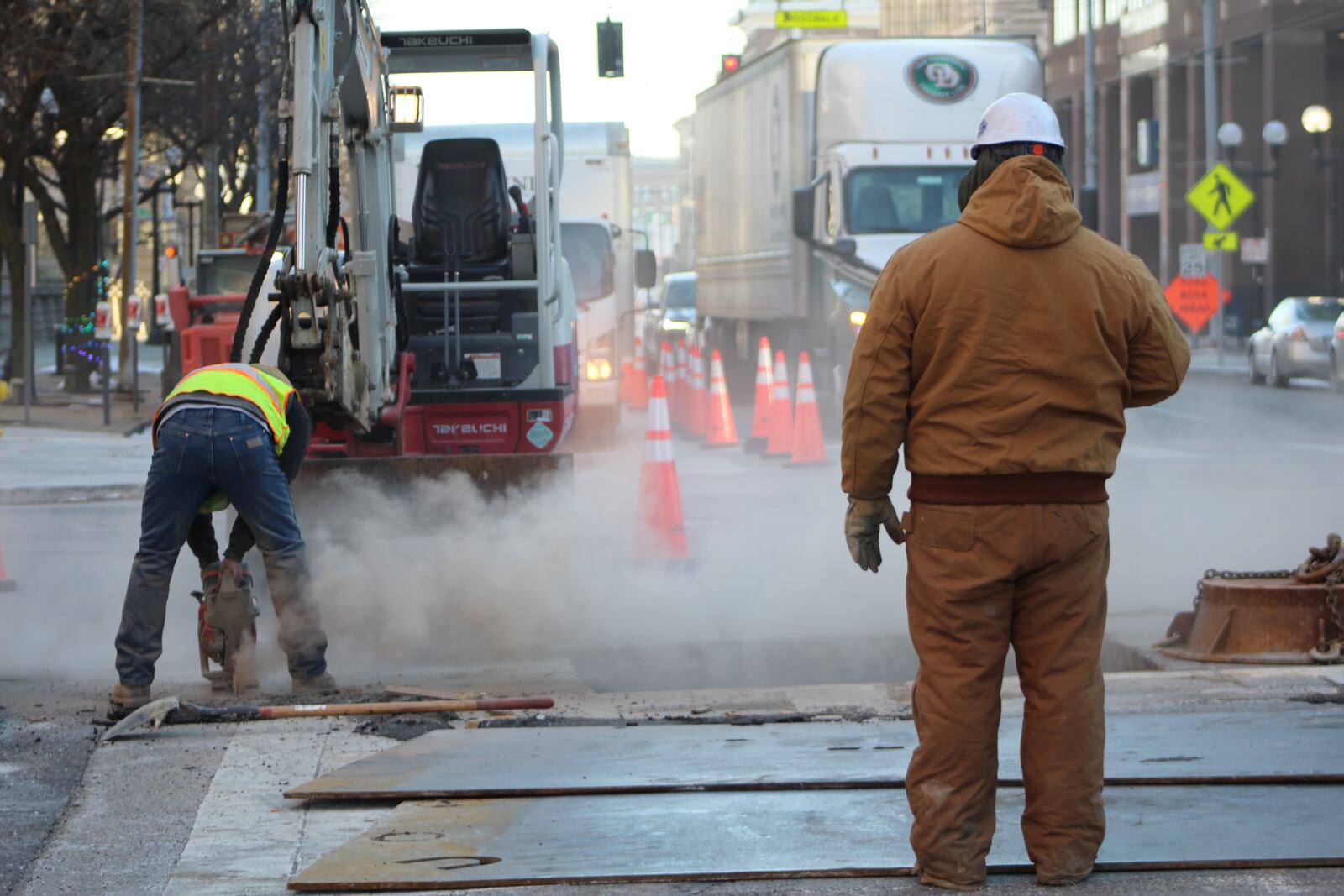 Crews work on infrastructure downtown. CORNELIUS FROLIK / STAFF