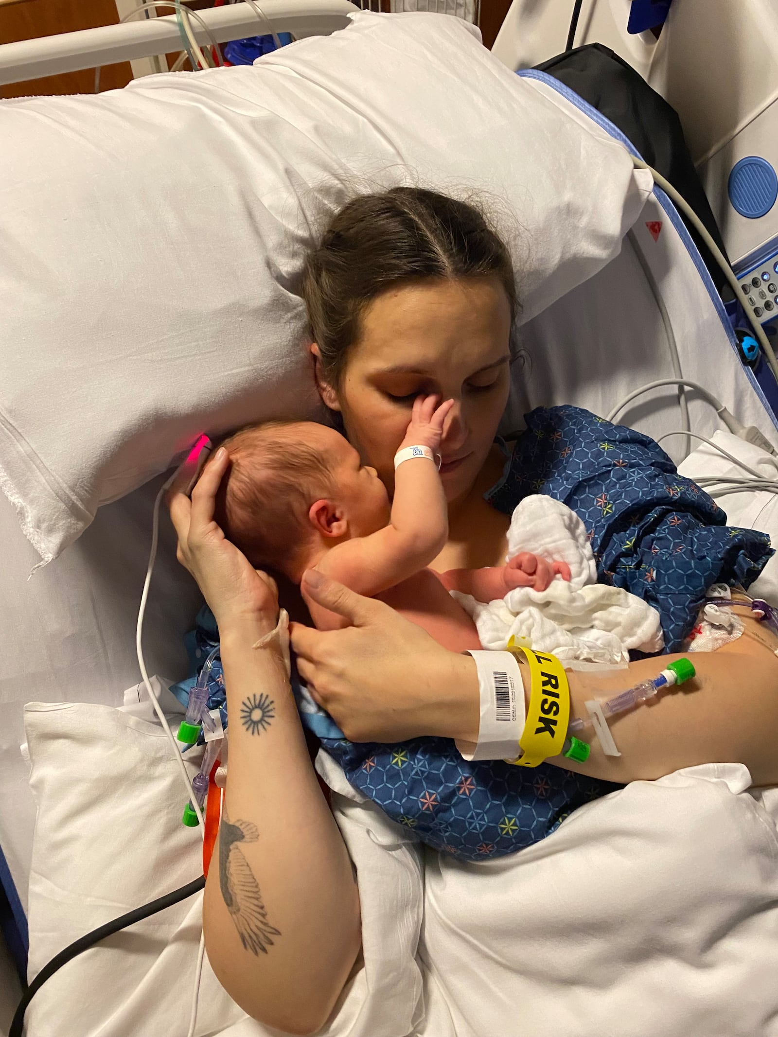 After being in a coma for three days at Atrium Medical Center after a cardiac procedure, Casey Gould finally was able to hold her son, Archer. SUBMITTED PHOTO