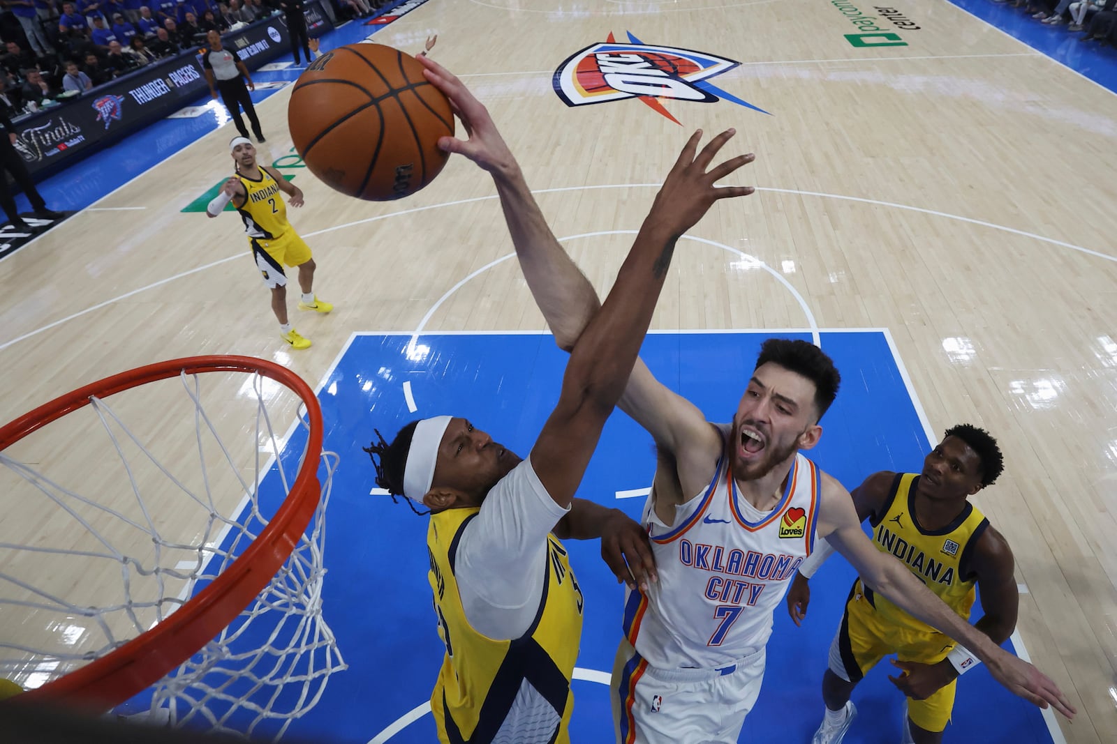 Oklahoma City Thunder forward Chet Holmgren (7) dunks against the Indiana Pacers during the second half of Game 5 of the NBA Finals basketball series, Monday, June 16, 2025, in Indianapolis. (Matthew Stockman/Pool Photo via AP)
