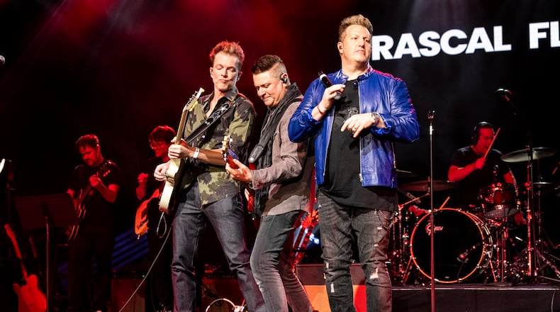 Joe Don Rooney, from left, Jay DeMarcus, and Gary LeVox of Rascal Flatts perform during the Big Machine Label Group Luncheon at Country Radio Seminar on Feb. 21, 2025, in Nashville, Tenn. (Photo by Amy Harris/Invision/AP)