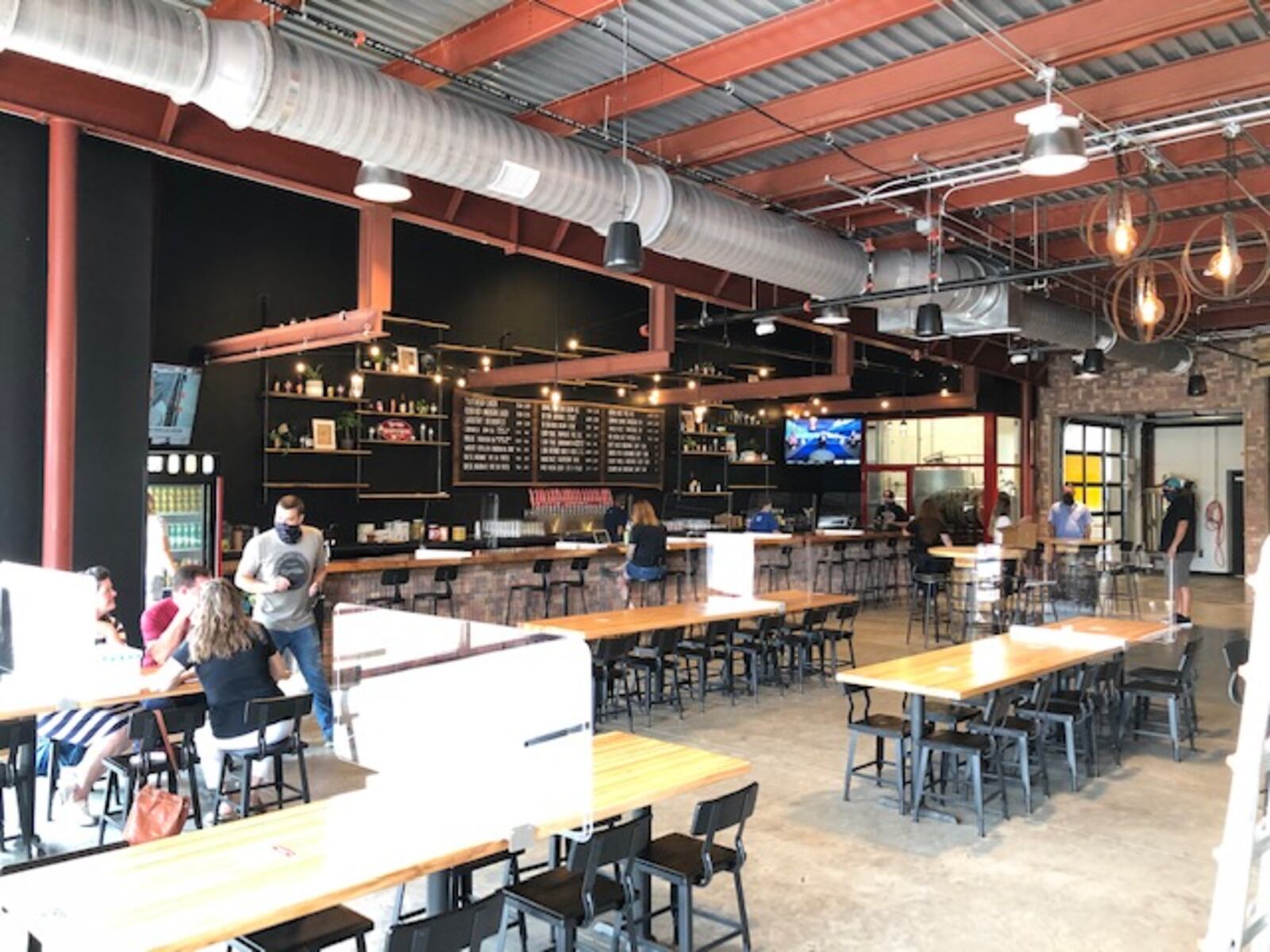 Dayton-based Warped Wing Brewing Co. will open its ambitious new second location, The Warped Wing Barrel Room & Smokery, to the public on Saturday, Aug. 29, in Springboro. MARK FISHER/STAFF


The 20,000-square-foot facility at the crossroads of Springboro at State Routes 73 and 741 will house a tap room, a restaurant, an outdoor biergarten-style patio, a large space for barrel-aging beers, a test-pilot brewery, a distribution hub and event space