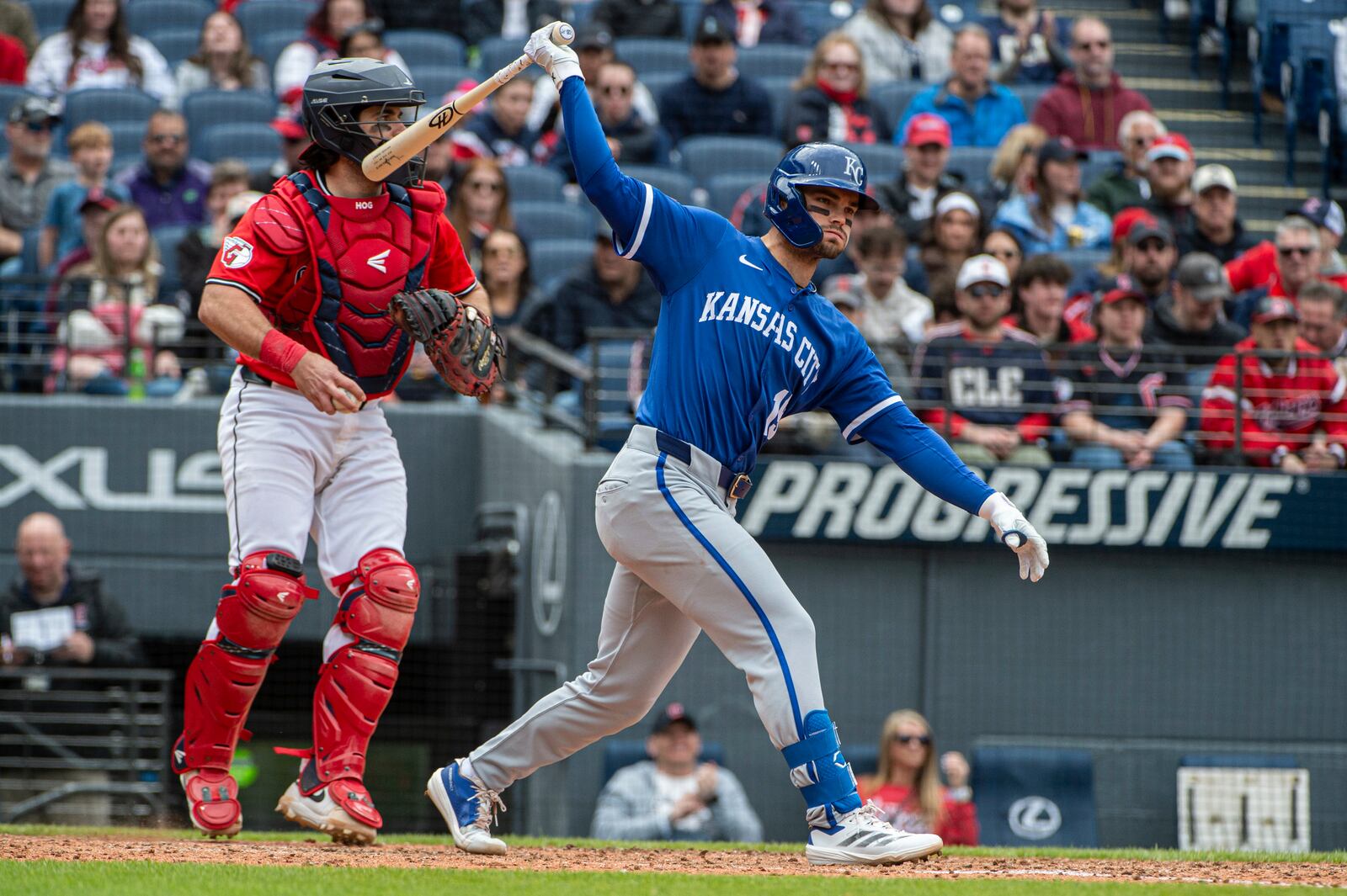 Kansas City Royals' Michael Massey strikes out on a pitch by Cleveland Guardians relief pitcher Joey Cantillo as catcher Austin Hedges looks away during the eighth inning of a baseball game in Cleveland, Sunday, April 13, 2025. (AP Photo/Phil Long)