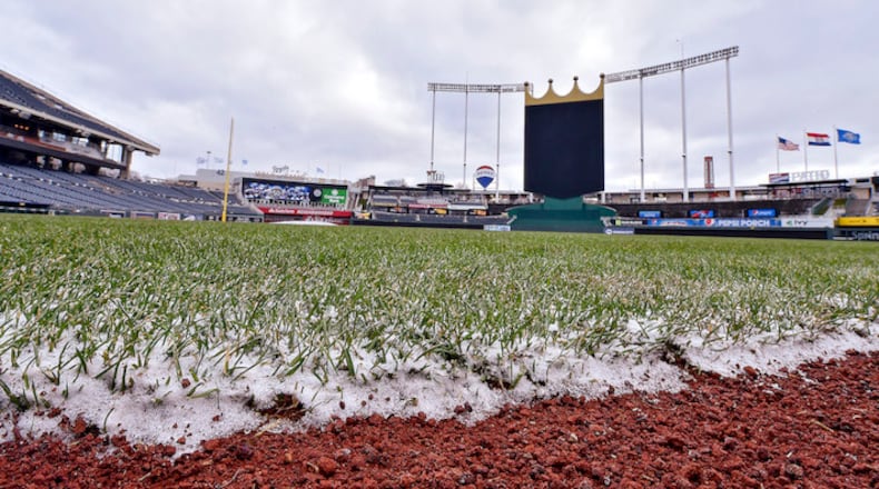 Snow clings to the edge of the grass following overnight flurries before a game between the Kansas City Royals and Los Angeles Angels on Sunday, April 15, 2018, at Kauffman Stadium in Kansas City, Mo. The game was postponed because of cold weather. (John Sleezer/Kansas City Star/TNS)
