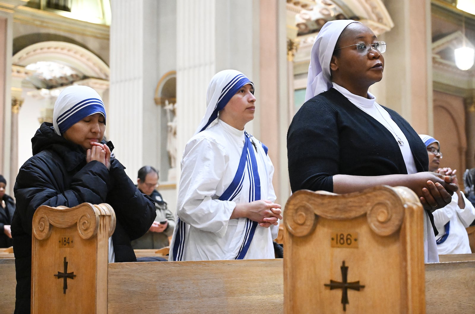 Church goers attend a mass to commemorate the late Pope Francis in Montreal, Saturday, April 26, 2025. (Graham Hughes /The Canadian Press via AP)