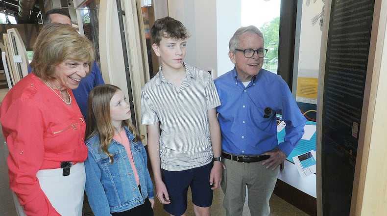 Ohio Governor Mike DeWine and first lady Fran, with grandchildren, Parker and Addie DeWine checkout one of the many historic displays Monday, June 3, 2024. inside the interpretive center at the Great Council State Park near Xenia. MARSHALL GORBY\STAFF