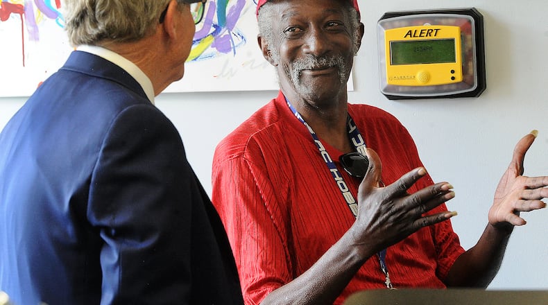 Willard Hardy, Goodwill Easterseals of Miami Valley Miracle Clubhouse member, talks with Ohio Governor Mike DeWine as he toured the Clubhouse Wednesday, May 24, 2023 in Dayton as part of the continuum of mental health care he is working to strengthen across the state. MARSHALL GORBY\STAFF