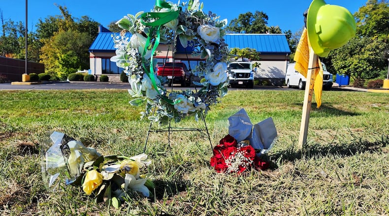 Memorial at the paver accident crash site on Main Street in Hamilton where Jacob Moler was killed and Damion Winkler injured on Oct. 3, 2023. NICK GRAHAM/STAFF